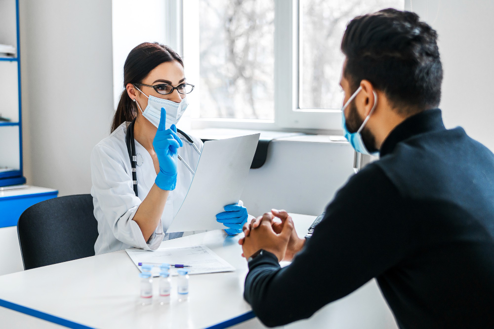 Doctor in a white coat speaking empathetically with a patient, highlighting Glabella's focus on patient-centered care through qualified placements